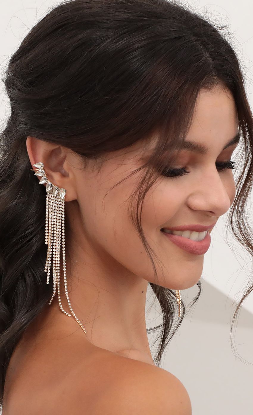 Picture Fringed Crystal-embellished Ear Cuff. Source: https://media-img.lucyinthesky.com/data/Jun20_1/850xAUTO/781A3699.JPG