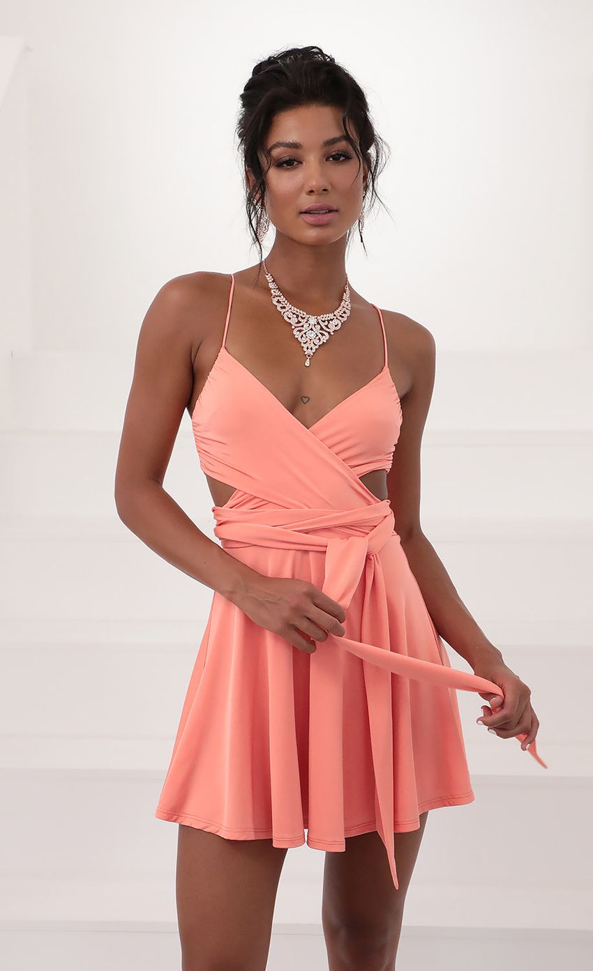 Picture Wrap Dress in Coral. Source: https://media-img.lucyinthesky.com/data/Jun20_2/850xAUTO/781A5527.JPG