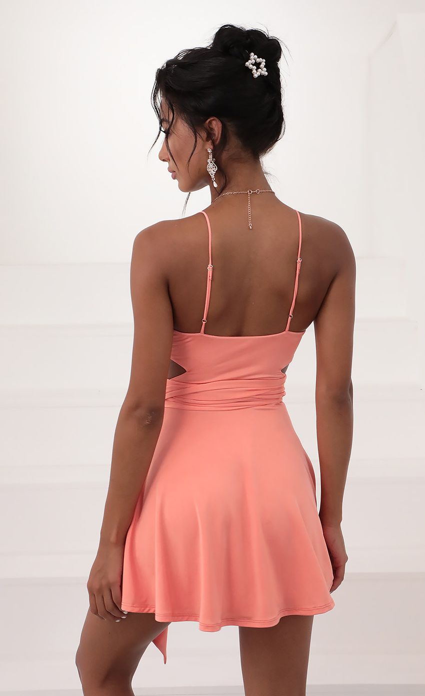 Picture Wrap Dress in Coral. Source: https://media-img.lucyinthesky.com/data/Jun20_2/850xAUTO/781A5622.JPG