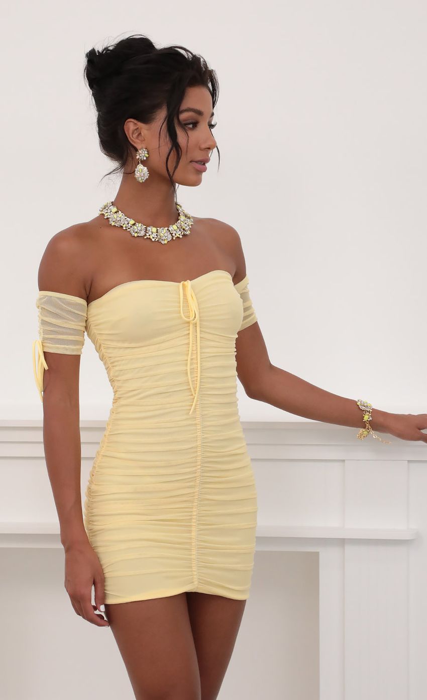 Picture Mesh Ties Dress in Yellow. Source: https://media-img.lucyinthesky.com/data/Jun20_2/850xAUTO/781A7475.JPG