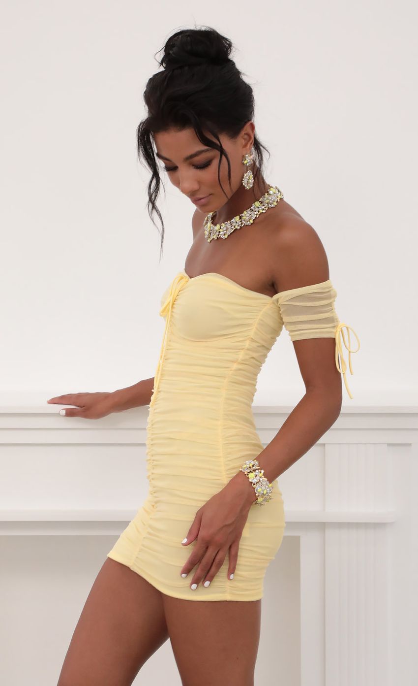 Picture Mesh Ties Dress in Yellow. Source: https://media-img.lucyinthesky.com/data/Jun20_2/850xAUTO/781A7488.JPG