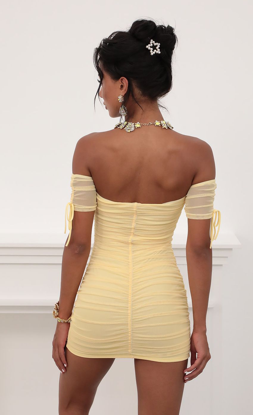 Picture Mesh Ties Dress in Yellow. Source: https://media-img.lucyinthesky.com/data/Jun20_2/850xAUTO/781A7518.JPG