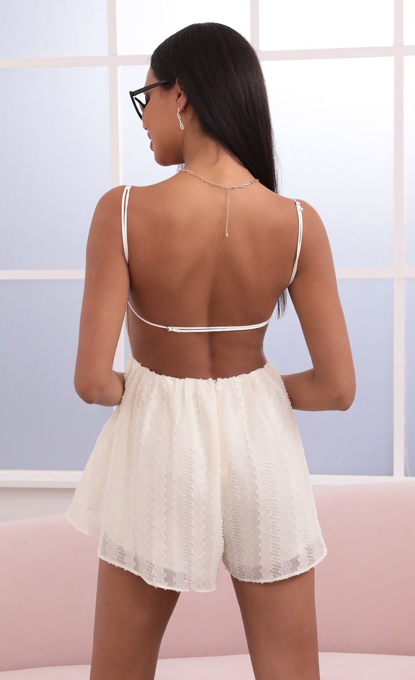Picture Fil Coupe Romper in Vanilla. Source: https://media-img.lucyinthesky.com/data/Jun21_1/850xAUTO/1V9A3436.JPG