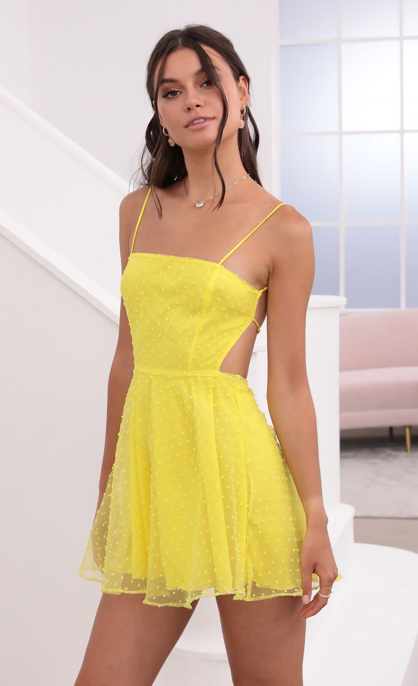 Picture Floral A-Line Dress in Yellow. Source: https://media-img.lucyinthesky.com/data/Jun21_2/850xAUTO/1V9A1966.JPG