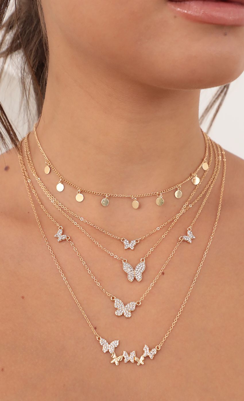 Picture Ava Layered Butterfly Necklace in Gold. Source: https://media-img.lucyinthesky.com/data/Jun21_2/850xAUTO/AT2A4037.JPG