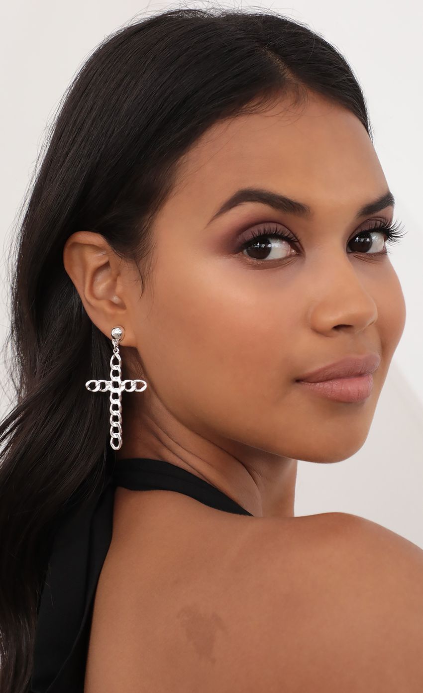 Picture Jada Cross Earrings in Silver. Source: https://media-img.lucyinthesky.com/data/Jun21_2/850xAUTO/AT2A7217.JPG