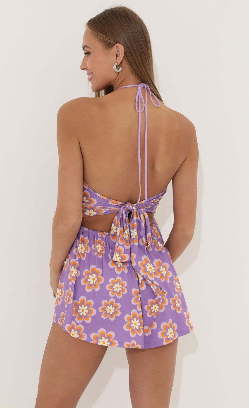 Picture Floral Cutout Romper in Purple. Source: https://media-img.lucyinthesky.com/data/Jun22_1/850xAUTO/1V9A4460.JPG