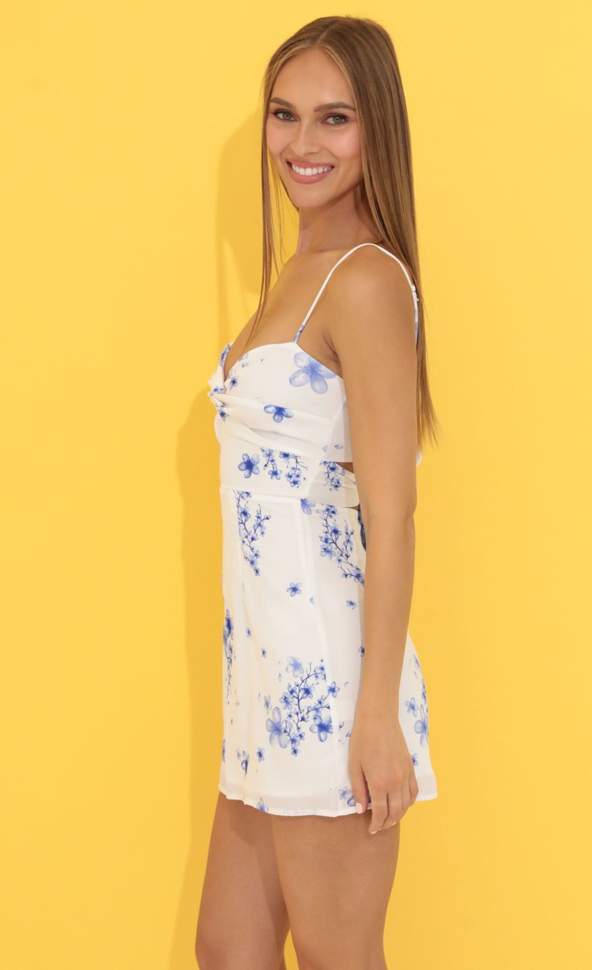 Picture Floral Front Twist Dress in White. Source: https://media-img.lucyinthesky.com/data/Jun22_1/850xAUTO/1V9A7418.JPG