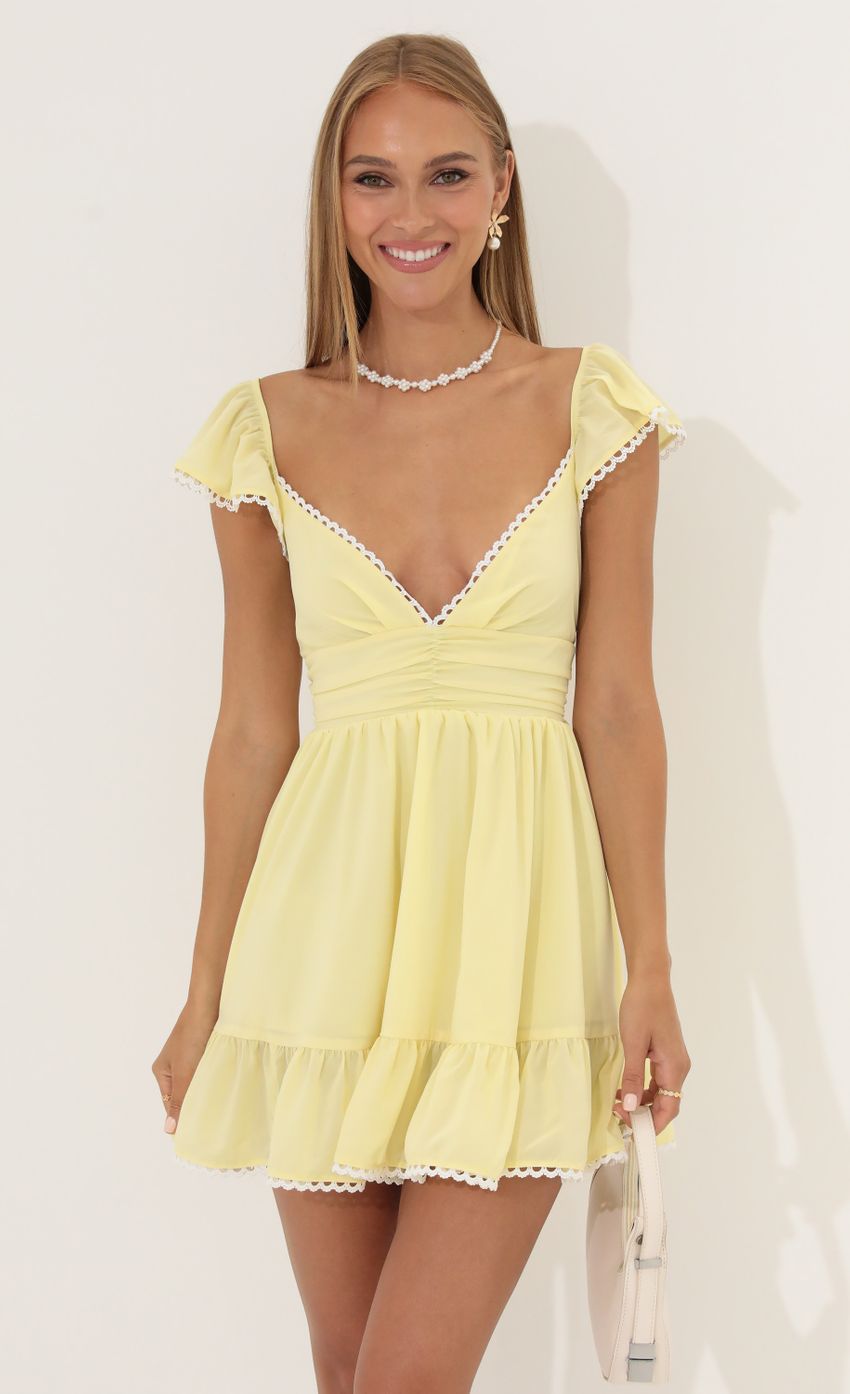 Picture Fit and Flare Chiffon Dress in Yellow. Source: https://media-img.lucyinthesky.com/data/Jun22_2/850xAUTO/1V9A4595.JPG