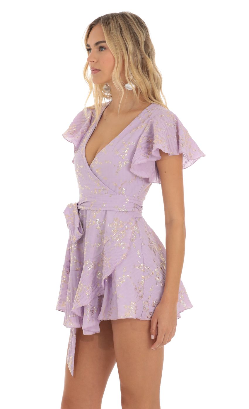 Picture Eliza Shimmer Floral Wrap Dress in Purple. Source: https://media-img.lucyinthesky.com/data/Jun23/850xAUTO/2fabce20-7e30-482a-8e8f-bcd78aada3ac.jpg
