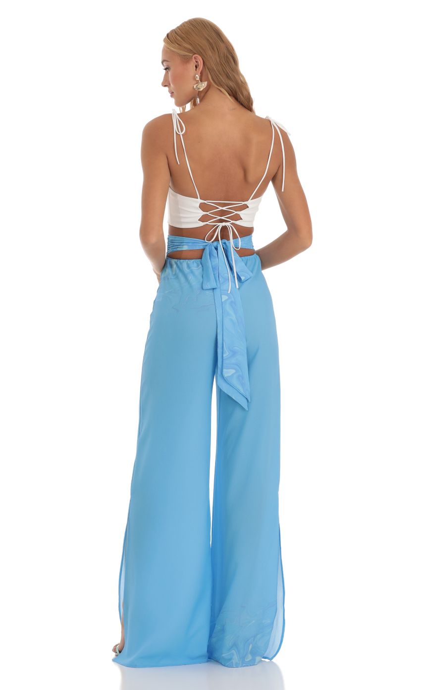 Picture Swirl Wide Leg Pants in Blue. Source: https://media-img.lucyinthesky.com/data/Jun23/850xAUTO/36fd5559-fe23-4299-a864-7be9e81a6c3a.jpg
