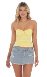 Picture Strapless Slits Top in Yellow. Source: https://media-img.lucyinthesky.com/data/Jun24/150xAUTO/0a3ca56e-7ce3-4796-b240-7c69a7e63c3d.jpg