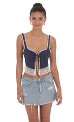 Picture Lace Vest Top in Navy. Source: https://media-img.lucyinthesky.com/data/Jun24/150xAUTO/3d98cded-836f-47d3-95ed-49338fd3f274.jpg