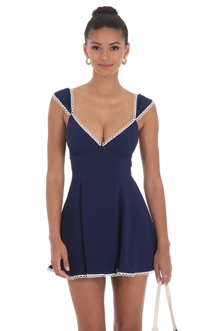 Picture Embroidered Trim Cap Sleeve Dress in Navy. Source: https://media-img.lucyinthesky.com/data/Jun24/850xAUTO/05f5fda6-cccb-4ec9-b178-fd330bacc50e.jpg
