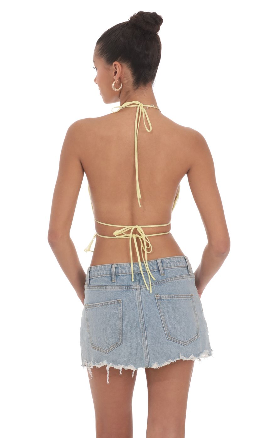 Picture Shimmer Halter Open Back Top in Yellow. Source: https://media-img.lucyinthesky.com/data/Jun24/850xAUTO/0b8cae84-8afc-4db4-8a0b-657109cffdb3.jpg