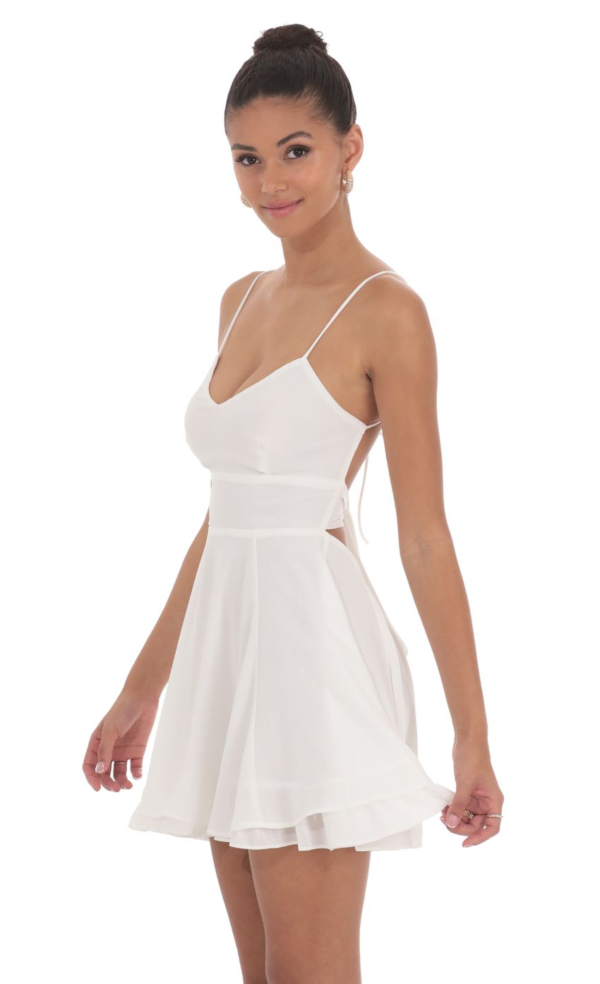 Picture Chiffon V-Neck Fit and Flare Dress in White. Source: https://media-img.lucyinthesky.com/data/Jun24/850xAUTO/0d83f884-22ce-4e28-a6be-6d154b777a79.jpg