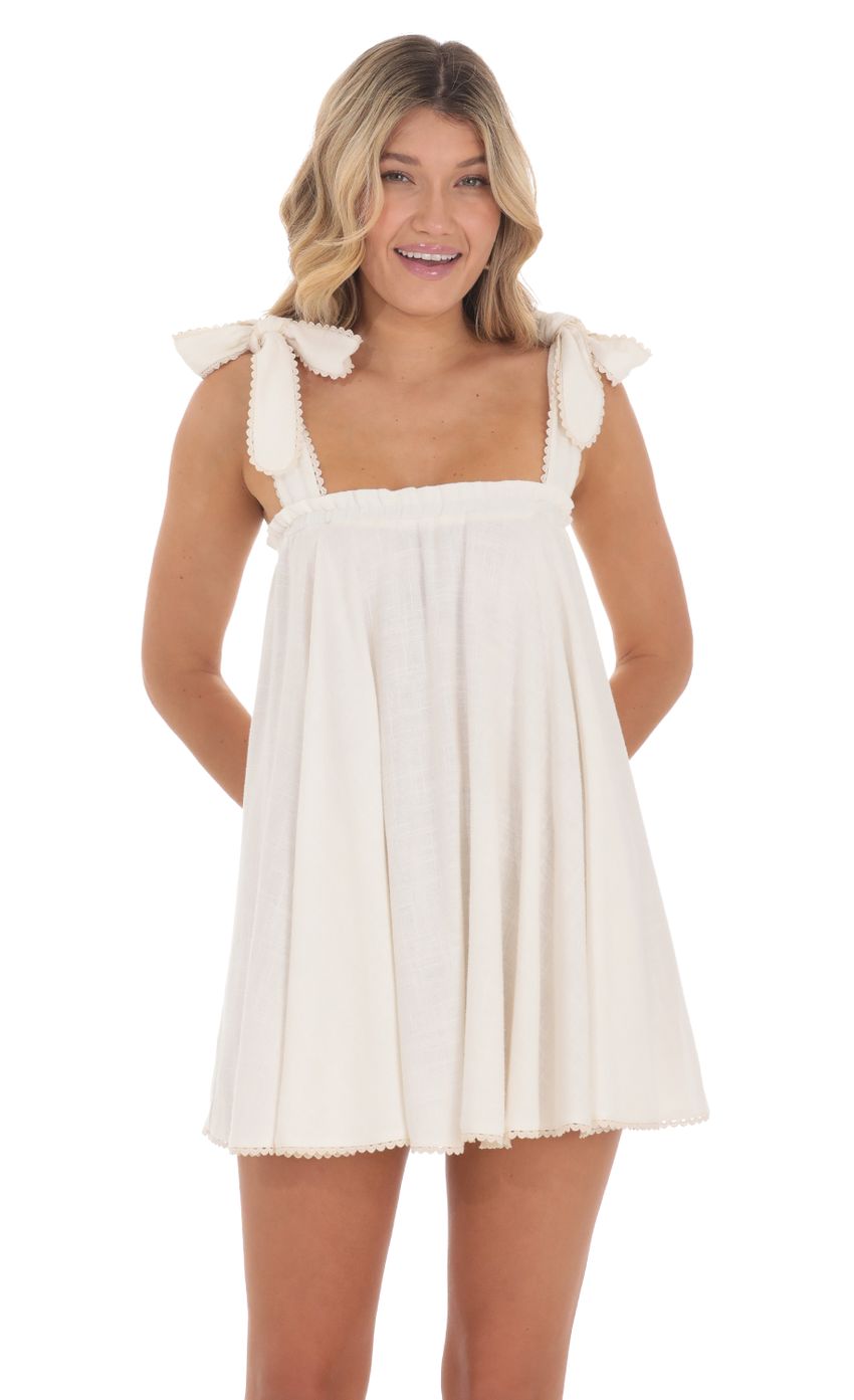 Picture Linen Shift Dress in Cream. Source: https://media-img.lucyinthesky.com/data/Jun24/850xAUTO/32c830bf-bc18-48b3-9fbf-3ea1111d3ab9.jpg