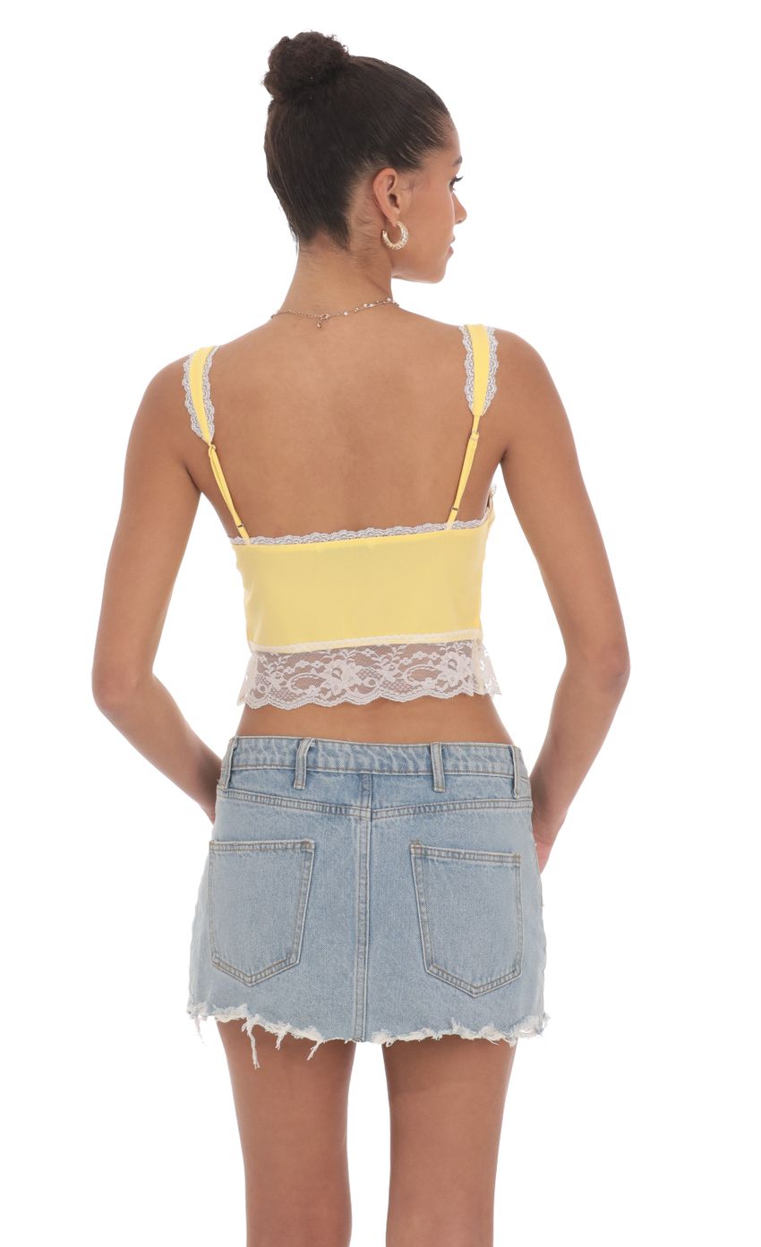 Picture Lace Vest Top in Yellow. Source: https://media-img.lucyinthesky.com/data/Jun24/850xAUTO/46cbb341-9289-4a24-bb66-9a1a00923caa.jpg