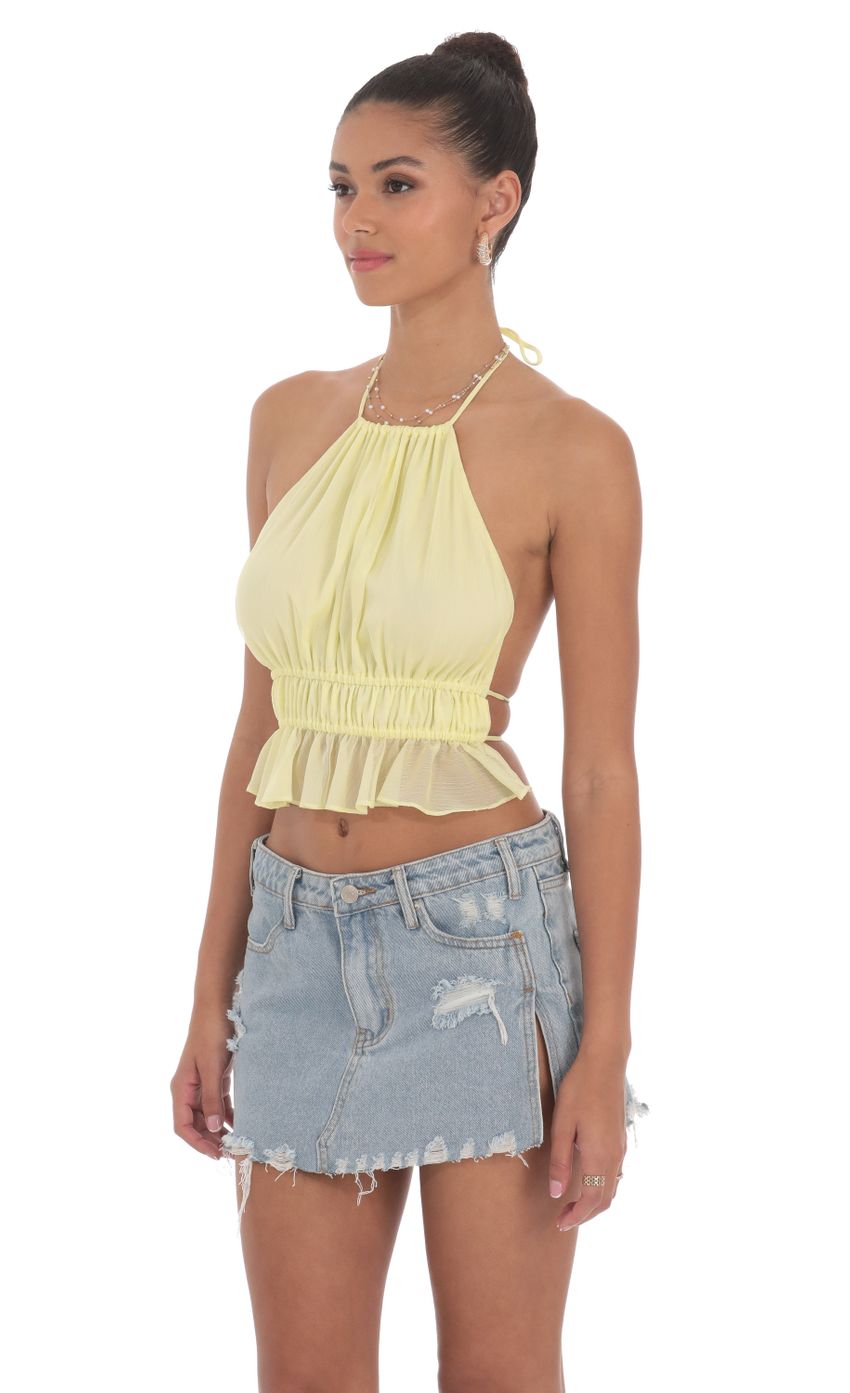 Picture Shimmer Halter Open Back Top in Yellow. Source: https://media-img.lucyinthesky.com/data/Jun24/850xAUTO/4e562927-51c6-4e40-a35b-b4d78c8e2150.jpg