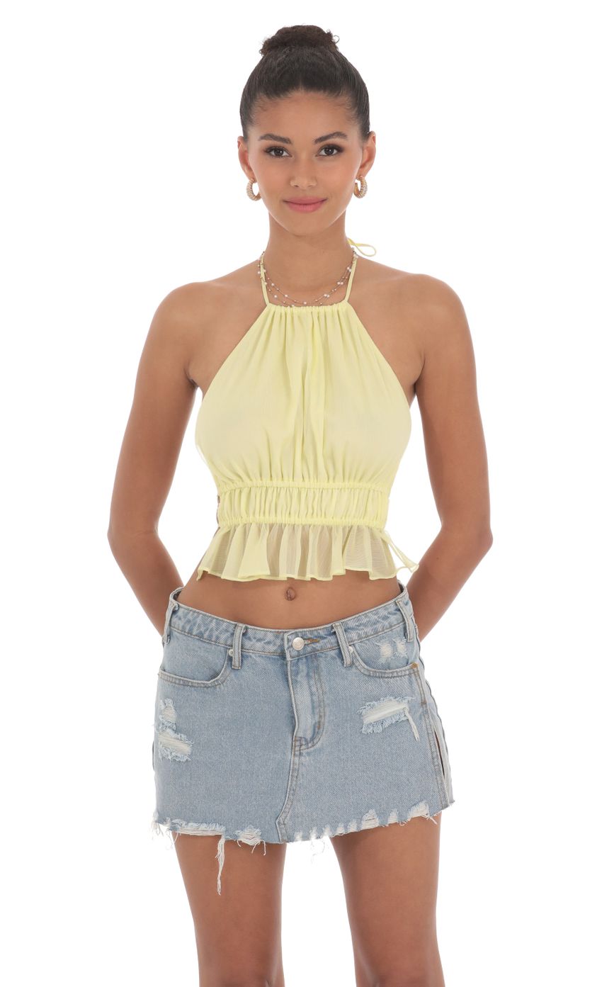 Picture Shimmer Halter Open Back Top in Yellow. Source: https://media-img.lucyinthesky.com/data/Jun24/850xAUTO/6a9318a8-eabf-42ce-a401-8e1d5ed79b90.jpg