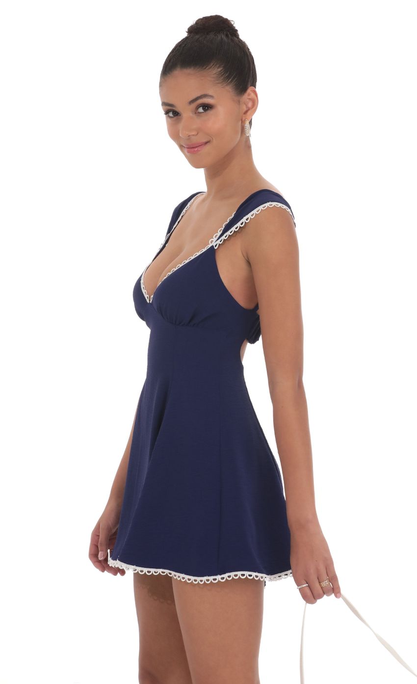 Picture Embroidered Trim Cap Sleeve Dress in Navy. Source: https://media-img.lucyinthesky.com/data/Jun24/850xAUTO/73aa03df-fa4e-4640-950a-429446fc7e62.jpg