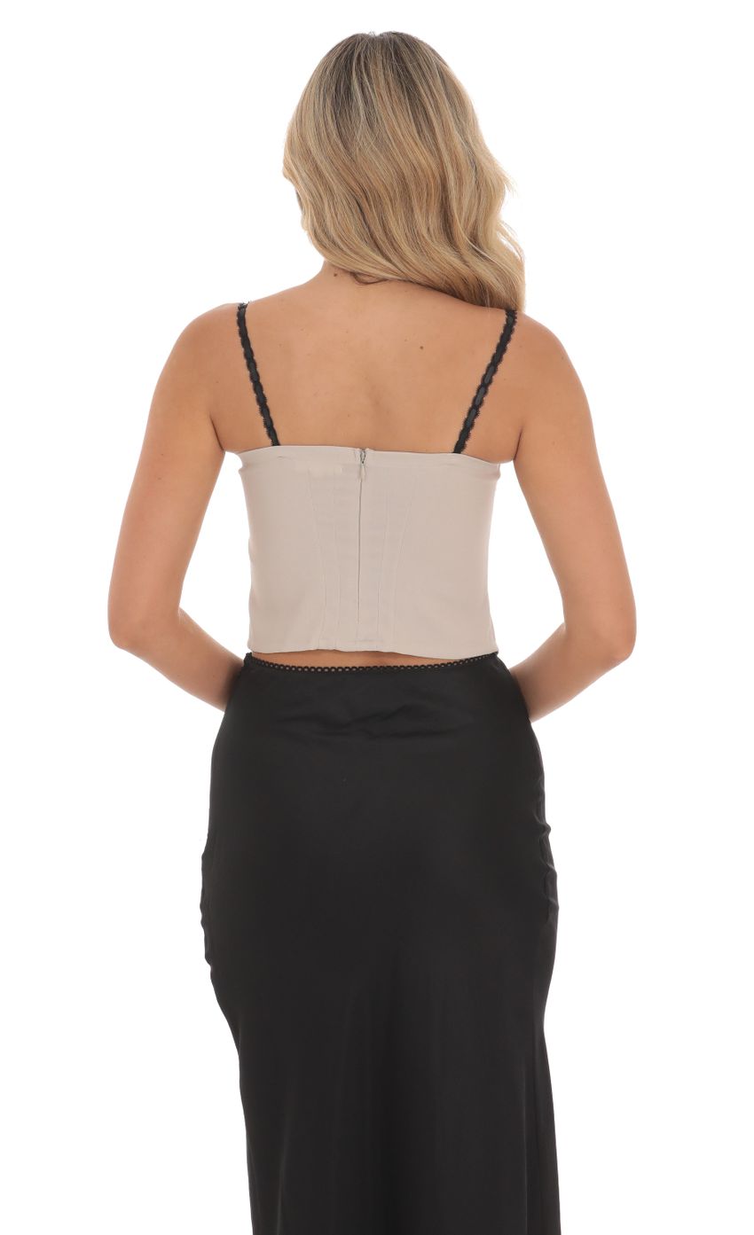 Picture Ribbon Lace Top in Taupe. Source: https://media-img.lucyinthesky.com/data/Jun24/850xAUTO/7ea95507-0cd6-4d0b-880a-84f593e7aa38.jpg