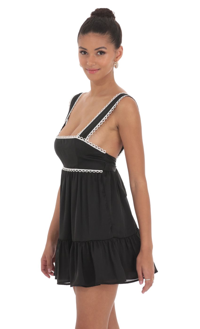 Picture Embroidered Trim Babydoll Dress in Black. Source: https://media-img.lucyinthesky.com/data/Jun24/850xAUTO/c5024ff5-7a19-4cc5-aa32-122eb982eb49.jpg