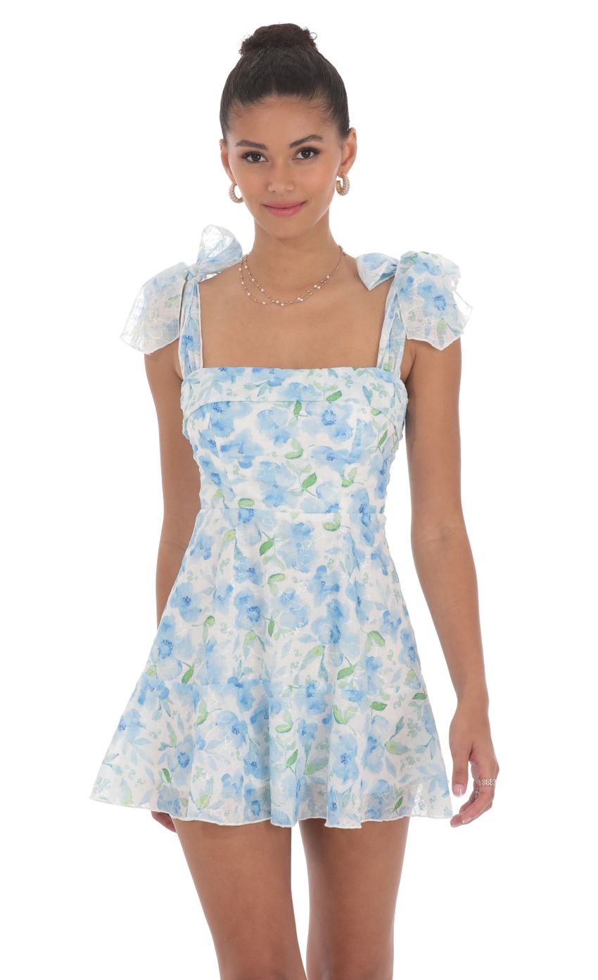 Picture Blue Floral A-line Dress in White. Source: https://media-img.lucyinthesky.com/data/Jun24/850xAUTO/c7c08922-542b-41a6-a41c-6dac972a79d4.jpg