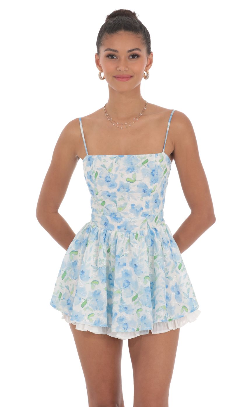 Picture Blue Floral Ruffle Romper in White. Source: https://media-img.lucyinthesky.com/data/Jun24/850xAUTO/d59ec62c-0345-41f2-8518-0d9a514afe8b.jpg