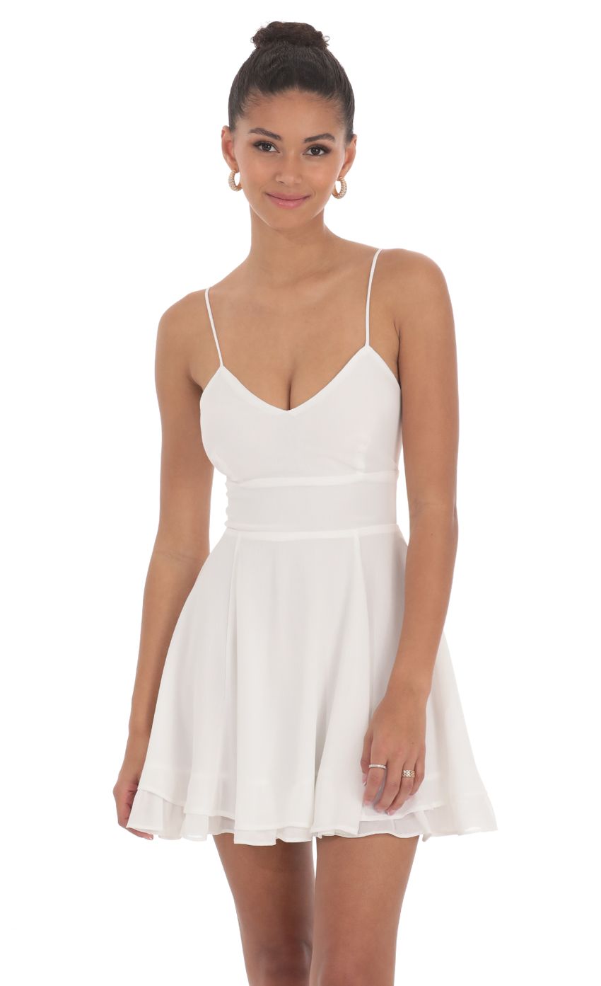 Picture Chiffon V-Neck Fit and Flare Dress in White. Source: https://media-img.lucyinthesky.com/data/Jun24/850xAUTO/ff550cf6-c331-4ba2-be3a-8e63defa983d.jpg