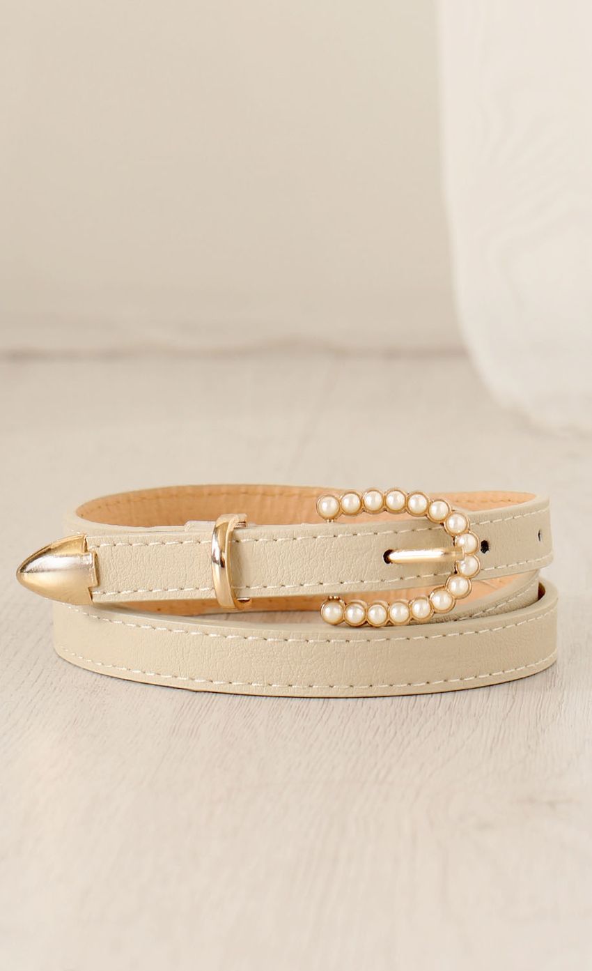 Picture Pearl Buckle Thin Waist Belt In Cream. Source: https://media-img.lucyinthesky.com/data/Mar15_1/850xAUTO/0Y5A2894.JPG