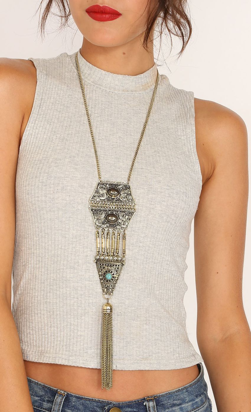 Picture Gold Accented Tassle Necklace. Source: https://media-img.lucyinthesky.com/data/Mar15_1/850xAUTO/0Y5A8561LIPS.JPG