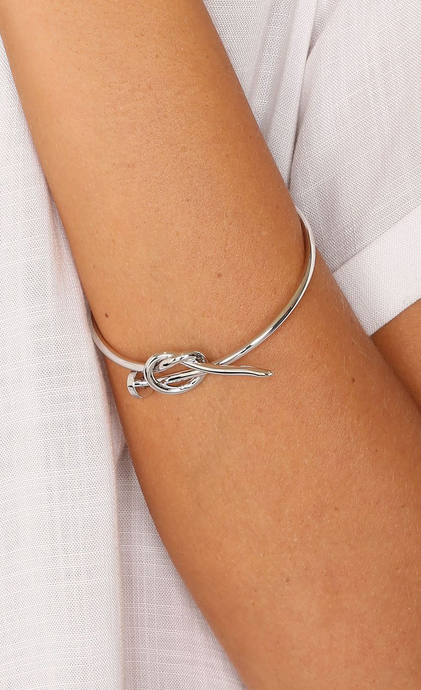 Picture Silver Accented Knot Bangle. Source: https://media-img.lucyinthesky.com/data/Mar15_1/850xAUTO/0Y5A8592.JPG