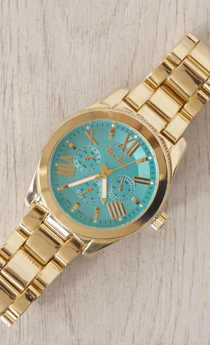 Picture Gold Wrist Watch with Green Face. Source: https://media-img.lucyinthesky.com/data/Mar15_2/850xAUTO/0Y5A02901.JPG
