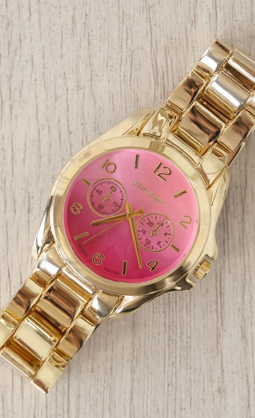 Picture Gold Wrist Watch with Pink Face. Source: https://media-img.lucyinthesky.com/data/Mar15_2/850xAUTO/0Y5A5048.JPG
