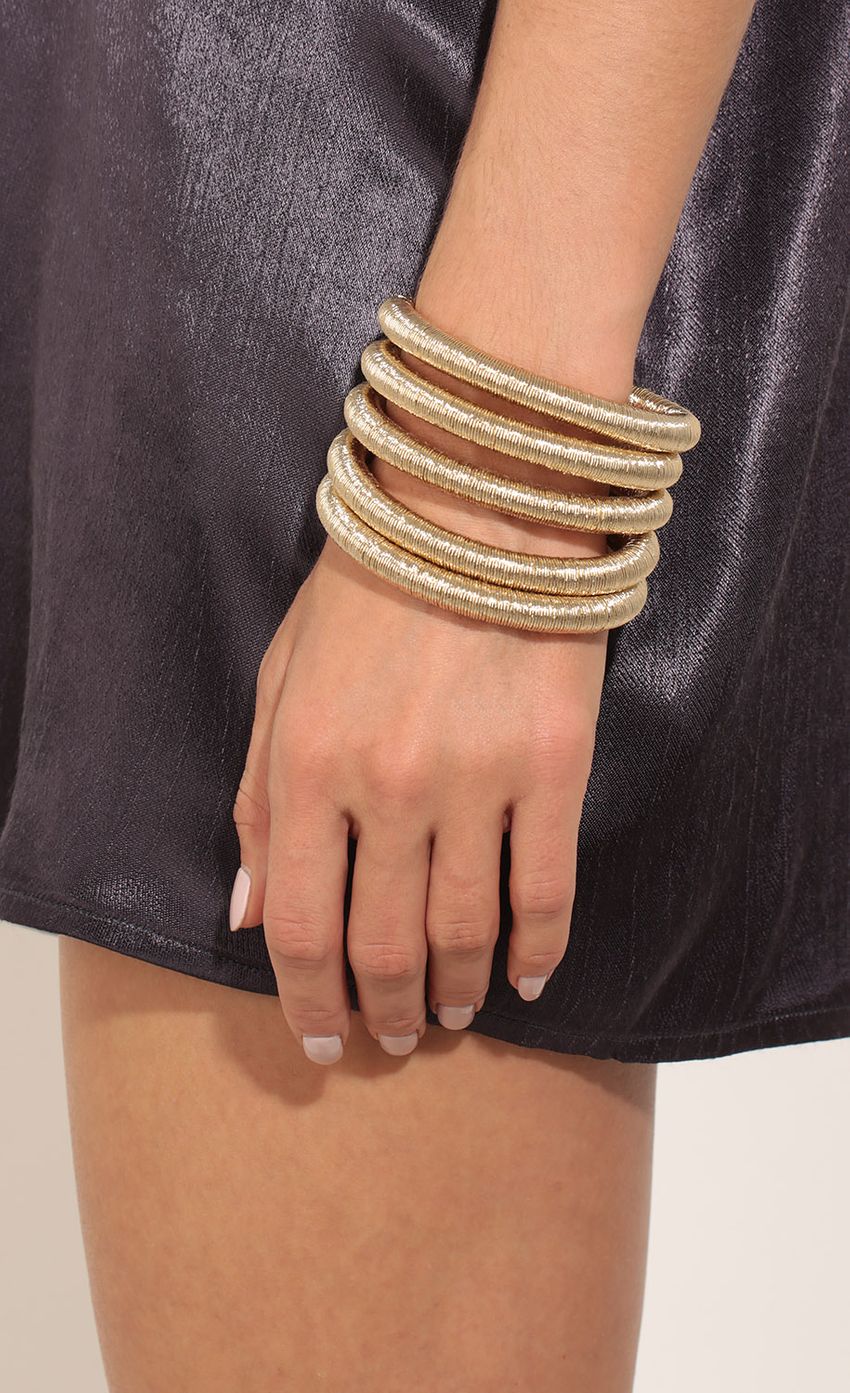 Picture Shimmer Coil Bracelet In Gold. Source: https://media-img.lucyinthesky.com/data/Mar17_1/850xAUTO/0Y5A7637.JPG