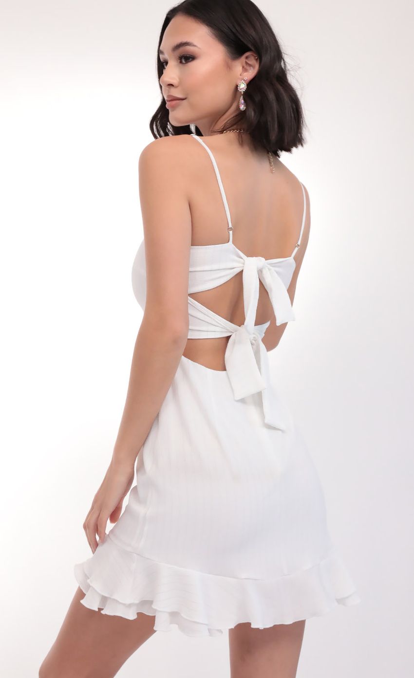 Picture Ruffle Dress In White Pinstripes. Source: https://media-img.lucyinthesky.com/data/Mar20_1/850xAUTO/781A6822.JPG