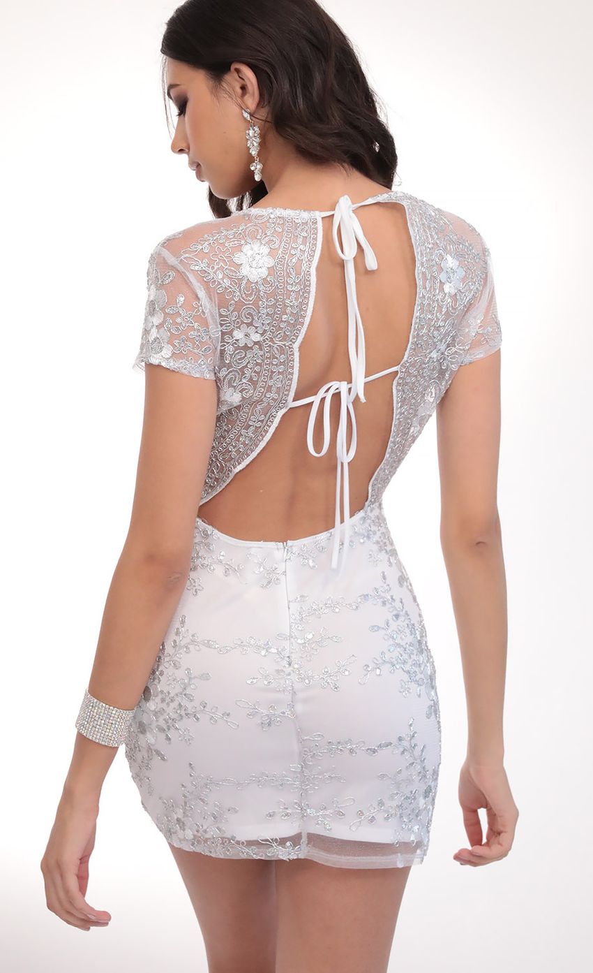 Picture Lani Sequin Plunge Lace Dress in White. Source: https://media-img.lucyinthesky.com/data/Mar20_2/850xAUTO/781A5174.JPG