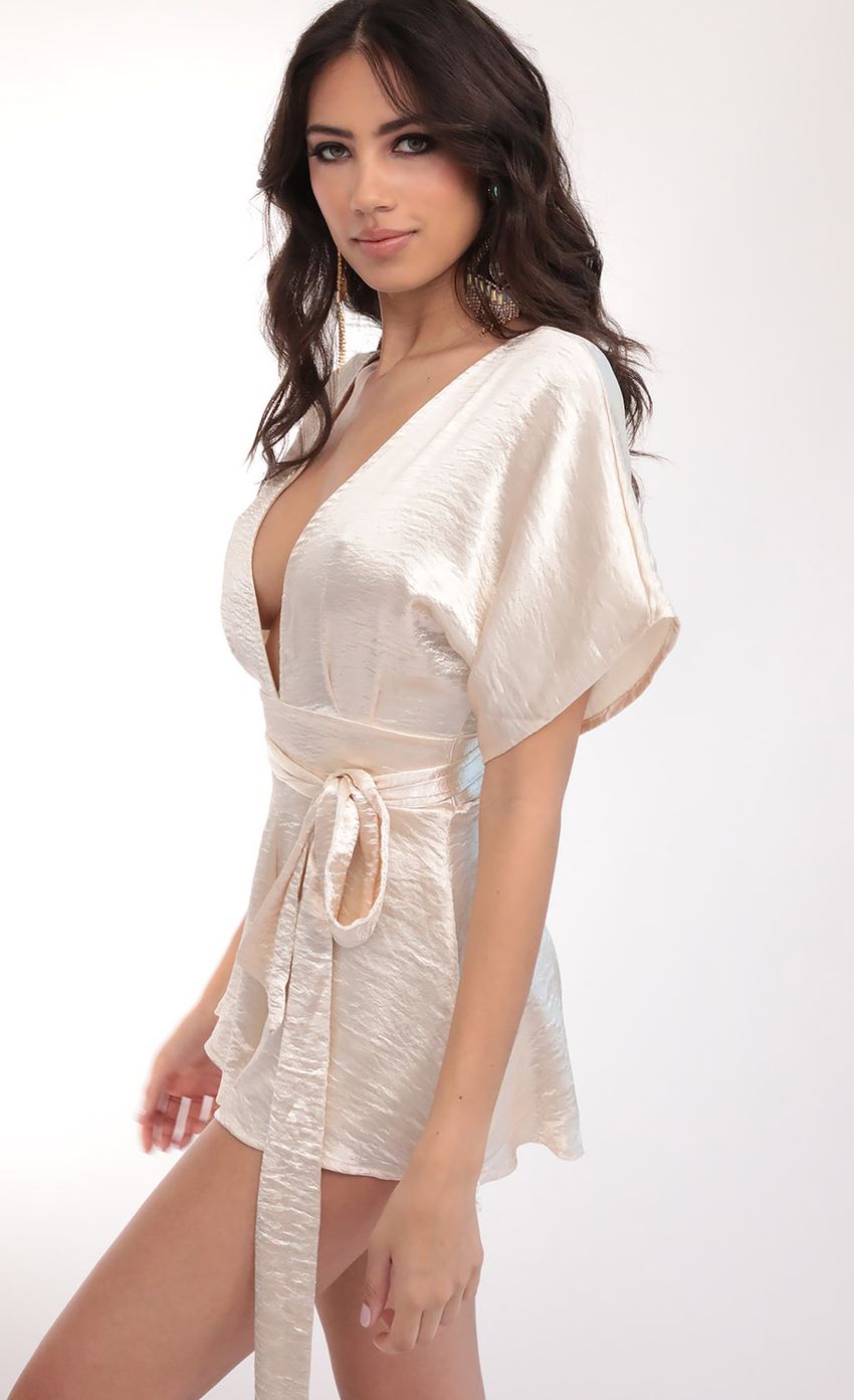 Picture Feeling The Night Satin Romper in Creme Brulee. Source: https://media-img.lucyinthesky.com/data/Mar20_2/850xAUTO/781A5545.JPG
