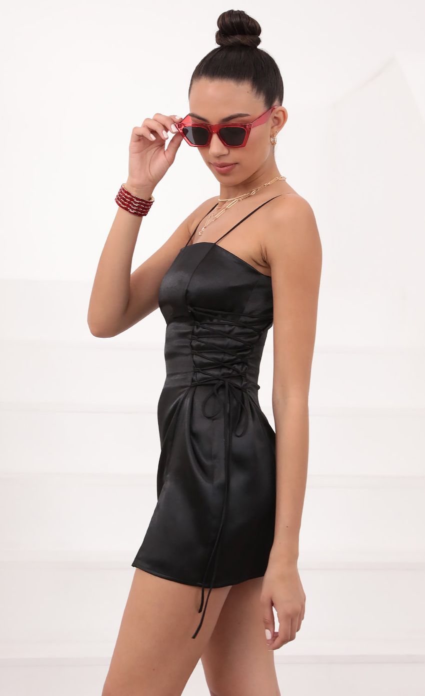 Picture Mini Dress in Black Satin. Source: https://media-img.lucyinthesky.com/data/Mar21_1/850xAUTO/1V9A2882.JPG