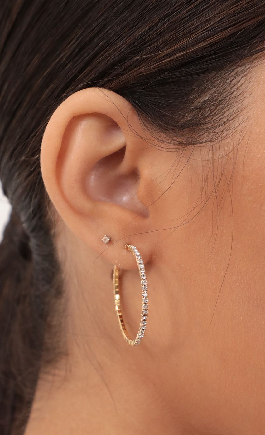 Picture Crystal Pave Wire Hoop in Gold. Source: https://media-img.lucyinthesky.com/data/Mar21_1/850xAUTO/AT2A1654_COPY.JPG