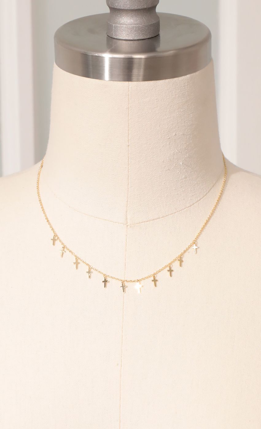 Picture Dainty Cross Charm Necklace in Gold. Source: https://media-img.lucyinthesky.com/data/Mar21_1/850xAUTO/AT2A6735_COPY.JPG