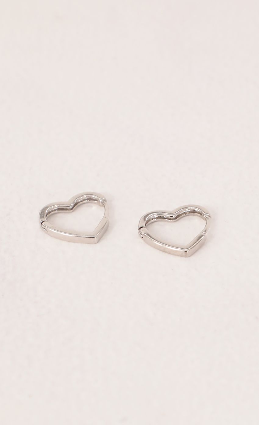 Picture Mini Heart Huggie Earrings in Silver. Source: https://media-img.lucyinthesky.com/data/Mar21_1/850xAUTO/AT2A6854.JPG