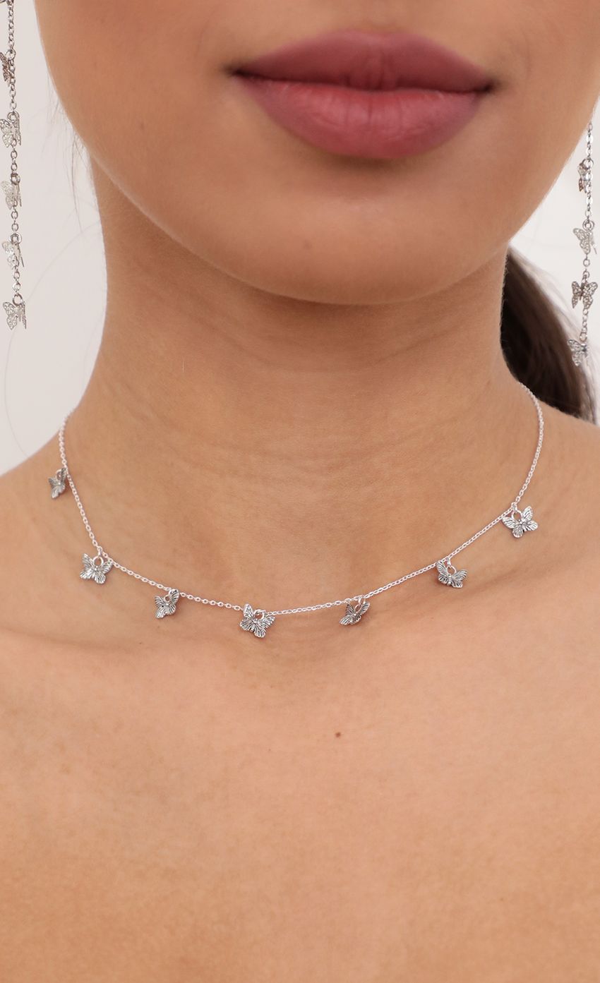 Picture Dangly Butterfly Charms Necklace in Silver. Source: https://media-img.lucyinthesky.com/data/Mar21_1/850xAUTO/AT2A9325_COPY.JPG