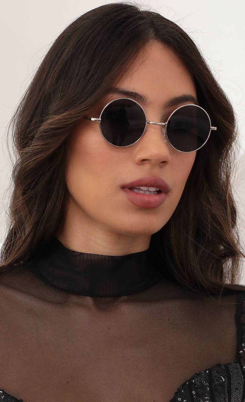 Picture Lennon Round Sunglasses in Black-Silver. Source: https://media-img.lucyinthesky.com/data/Mar21_1/850xAUTO/AT2A9860_COPY.JPG