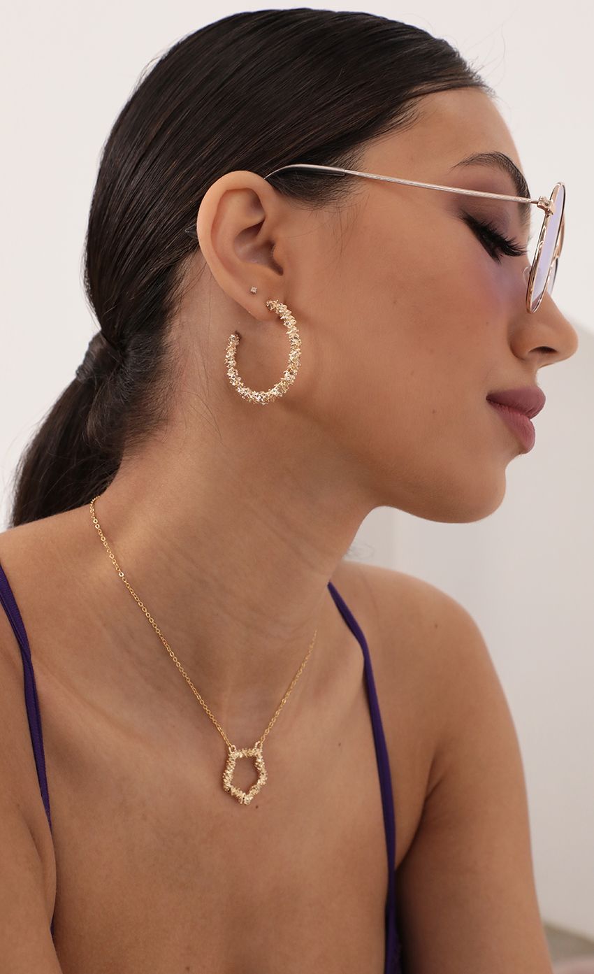 Picture Textured Sparkly Gold Hoops. Source: https://media-img.lucyinthesky.com/data/Mar21_1/850xAUTO/AT2A9905_COPY.JPG