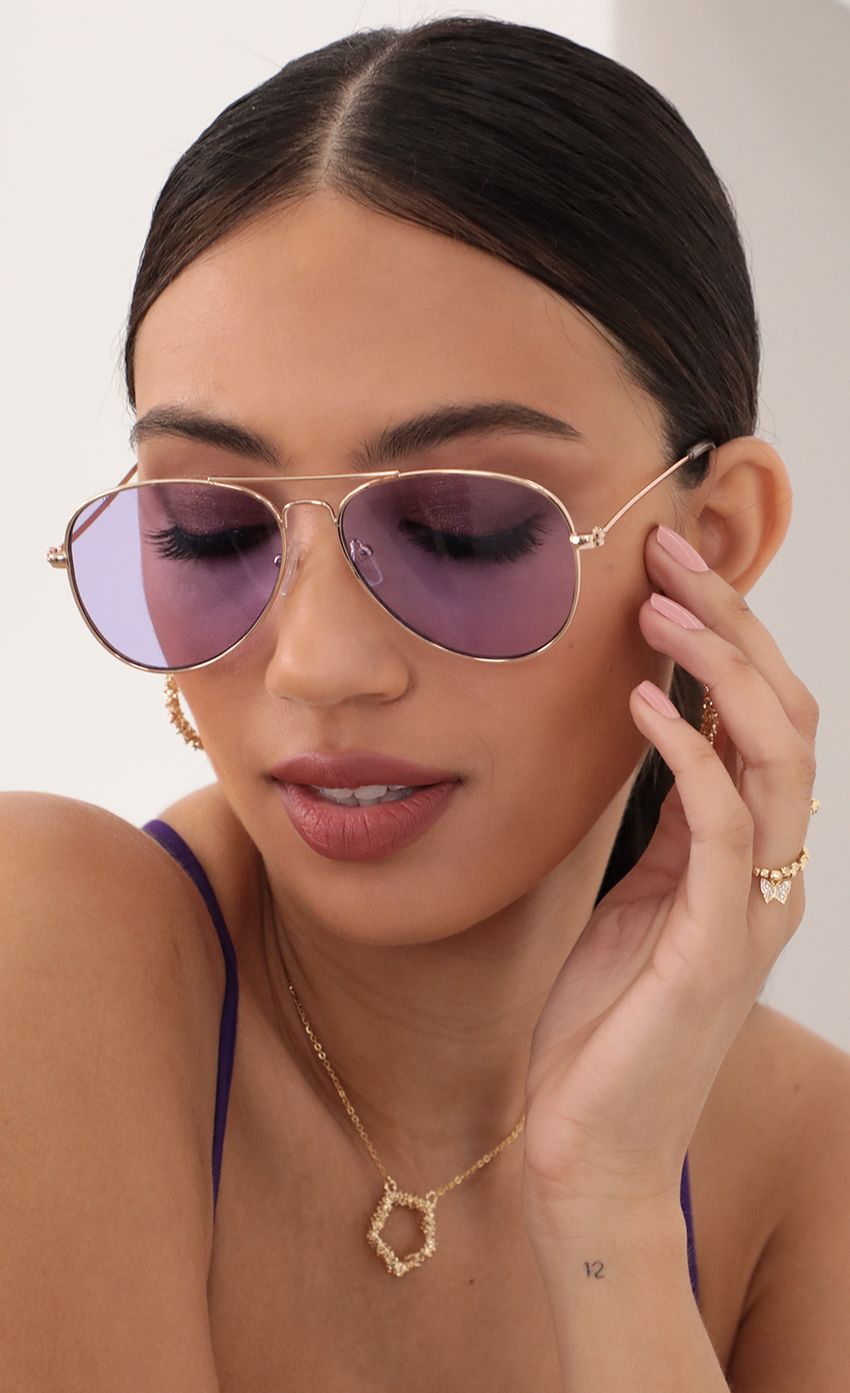 Picture Iconic Retro Aviator Sunglasses in Purple. Source: https://media-img.lucyinthesky.com/data/Mar21_1/850xAUTO/AT2A9911_COPY.JPG