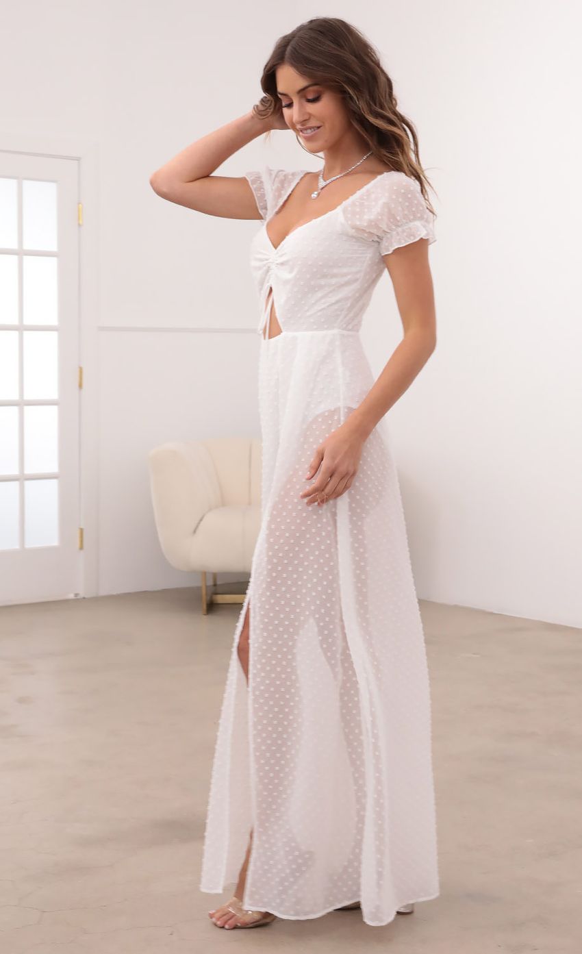 Picture Puff Sleeve Chiffon Maxi in White Dots. Source: https://media-img.lucyinthesky.com/data/Mar21_2/850xAUTO/1V9A1050.JPG