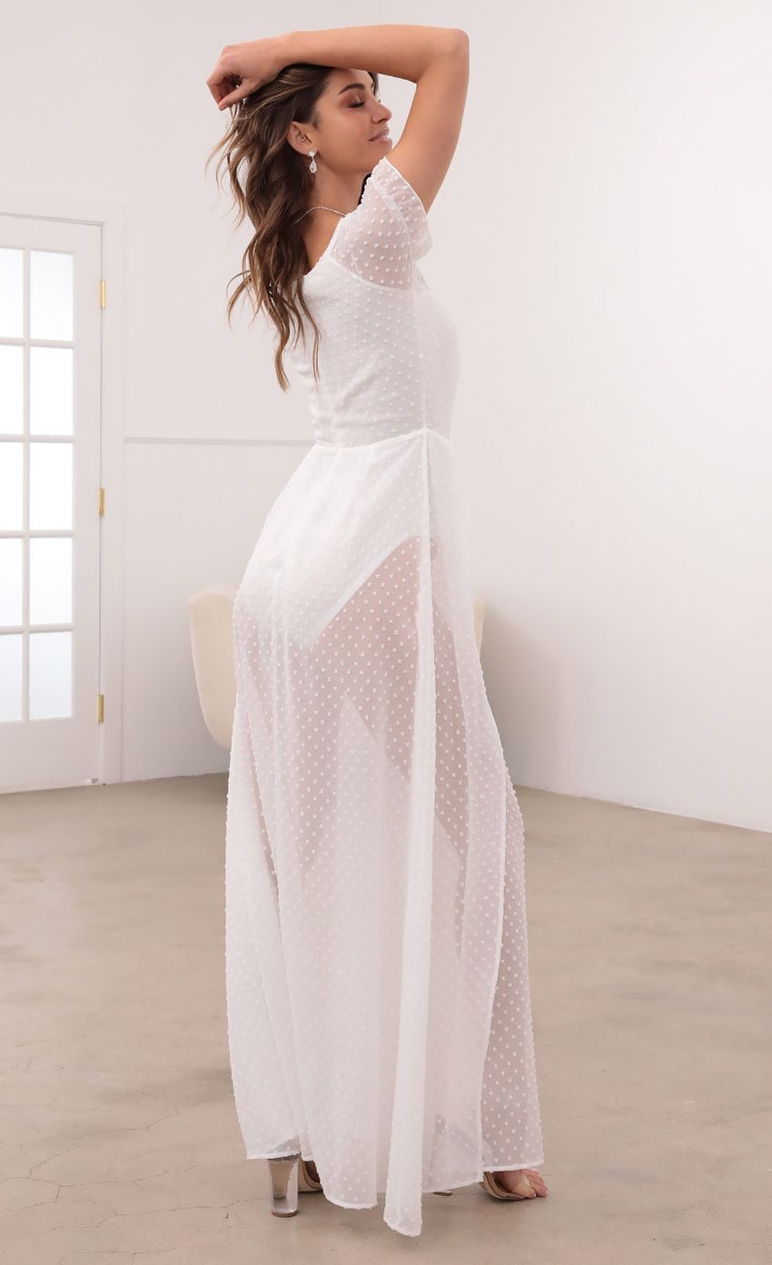 Picture Puff Sleeve Chiffon Maxi in White Dots. Source: https://media-img.lucyinthesky.com/data/Mar21_2/850xAUTO/1V9A1083.JPG