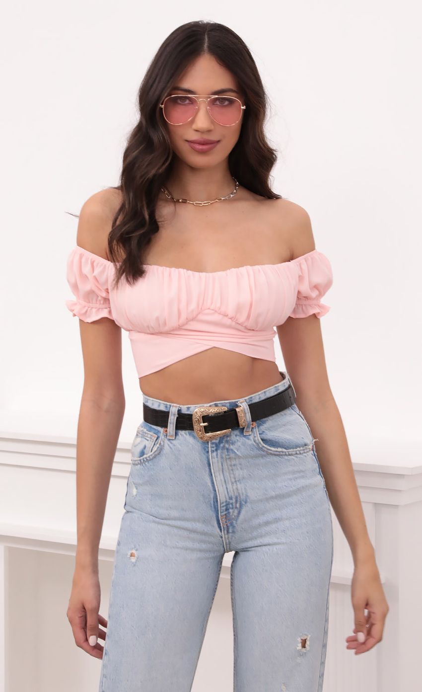 Picture Mariana Pink Ruched Wrap Top. Source: https://media-img.lucyinthesky.com/data/Mar21_2/850xAUTO/1V9A4191.JPG